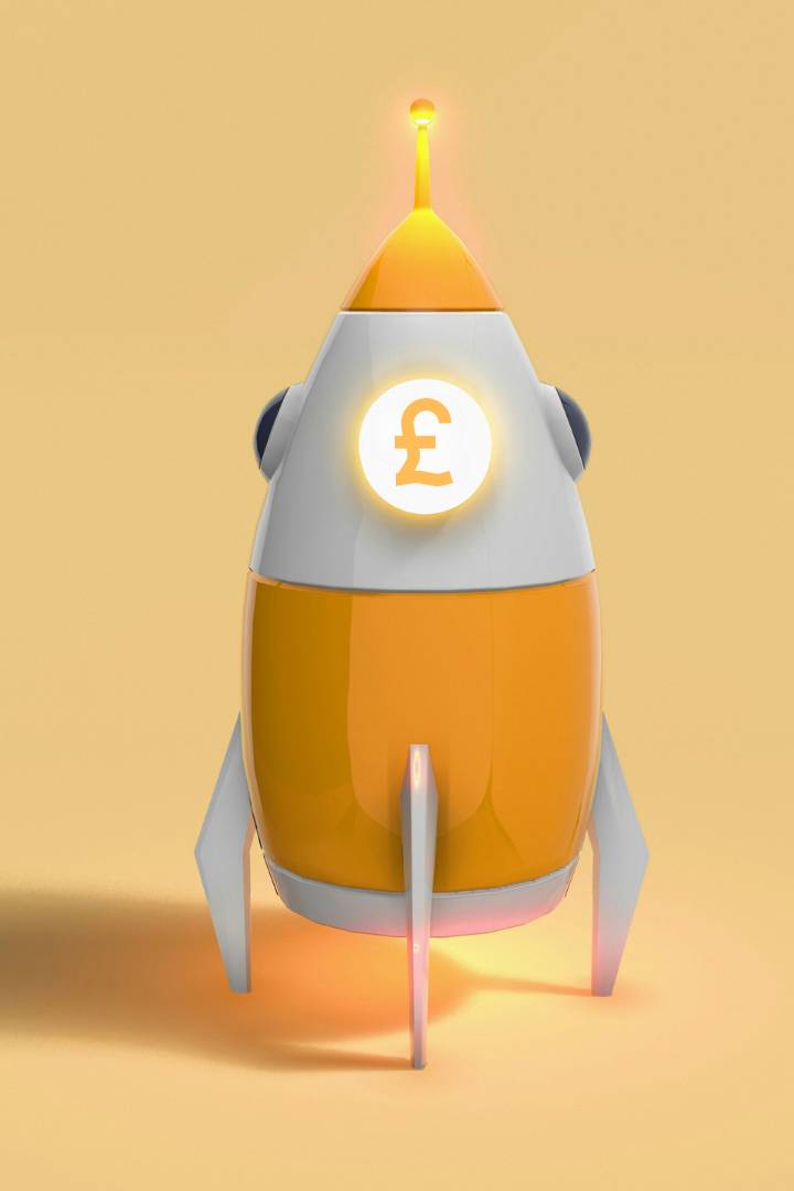 illustration of a rocket with a £ symbol on it with an orange background