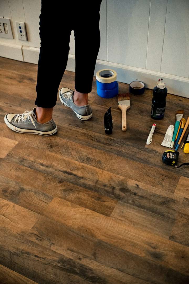 Various tools on a wooden floor for property maintenance