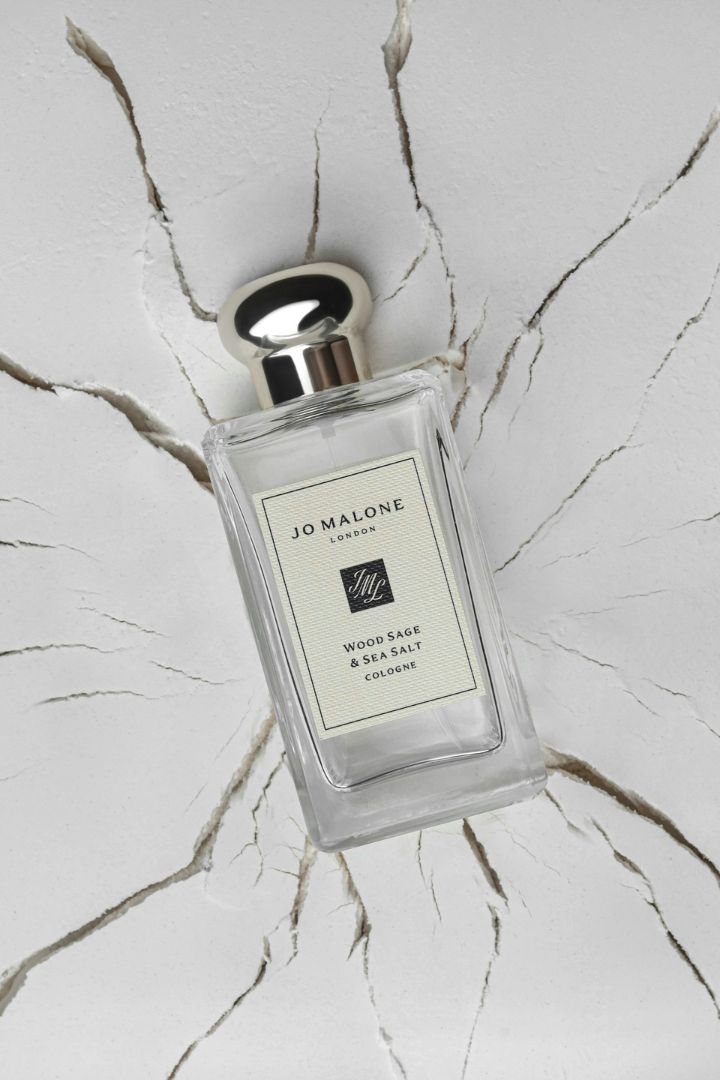 Jo Malone perfume and a cracked, white surface